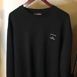 Acne Studios black sweater with enameled detailing